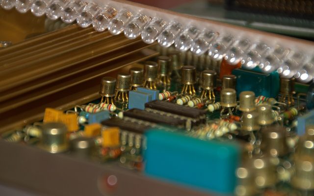 Close-up of a printed circuit board with chips, traces and components