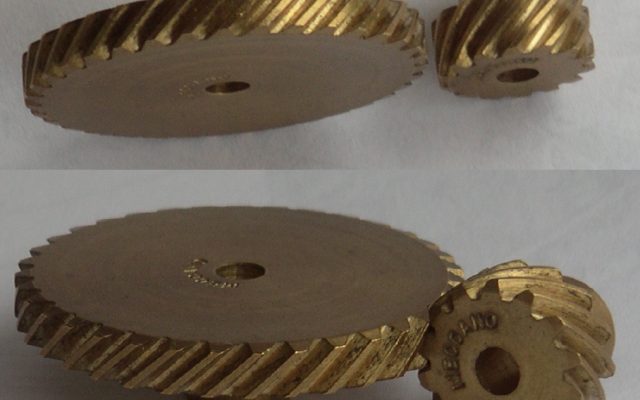 Close-up of meshing metal helical gears
